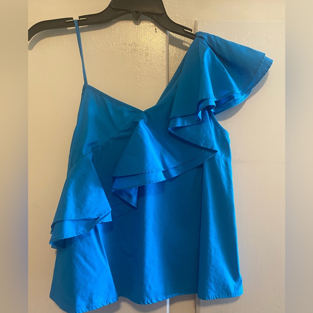 Adorable blue ruffle shirt! Never worn